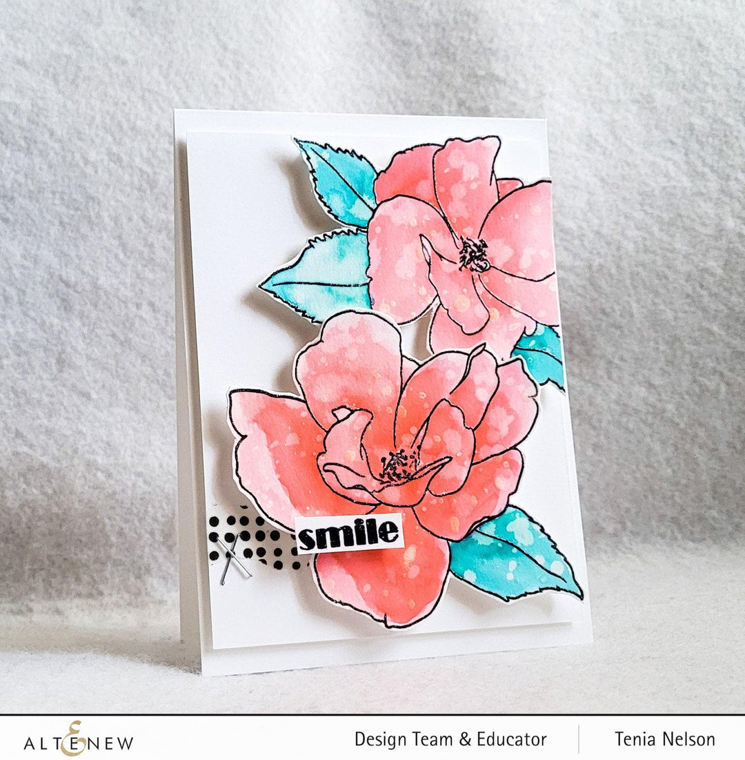 Altenew Paint-A-Flower China Rose and Hawaiian Shores stamp and watercolor pen bundle with brushes and fine tip pens for crafting.