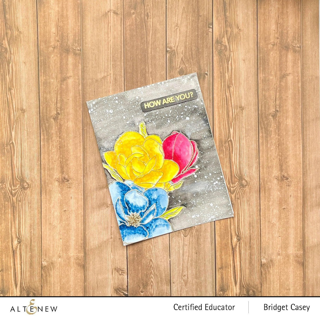 Altenew Paint-A-Flower Magnolia Rustica Rubra and Hawaiian Shores watercolor bundle with stamps, brushes, and fine tip pens.