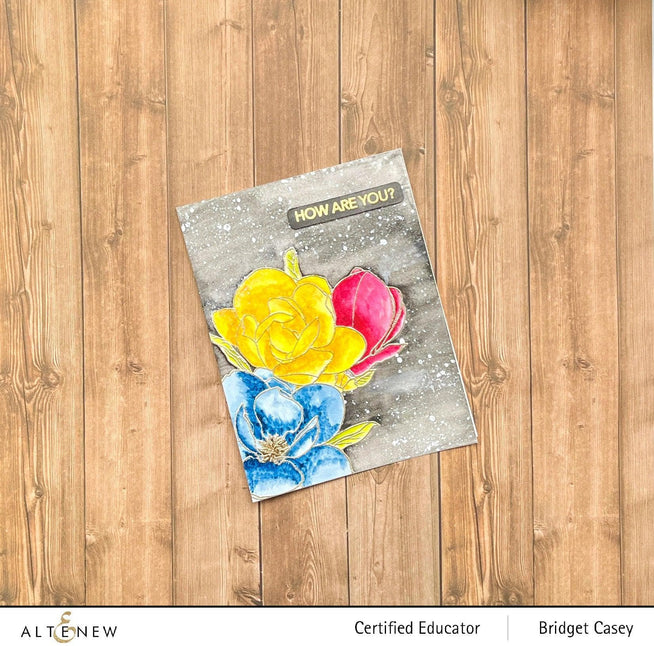 Altenew Paint-A-Flower Magnolia Rustica Rubra and Hawaiian Shores watercolor bundle with stamps, brushes, and fine tip pens.