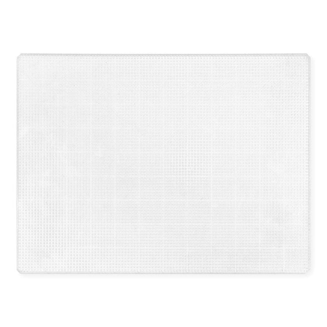 Altenew Original Sticky Mat 9x12 inches with grid lines, used for precise crafting and stamping projects.