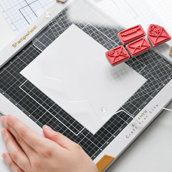 Altenew Next-Level Stamping Starter Bundle with tools including stamp blocks, ink pads, and accessories for crafting.
