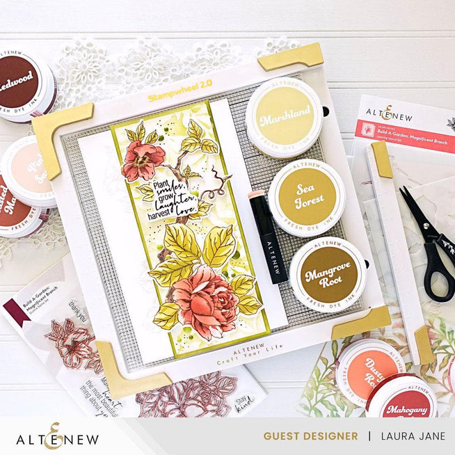 Altenew Stampwheel 2.0 tool for stamping and crafting, featuring a circular wheel with adjustable stamps for precise designs.