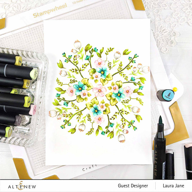 Altenew Stampwheel 1.0 Meta tool showing colorful stamping designs on a white background