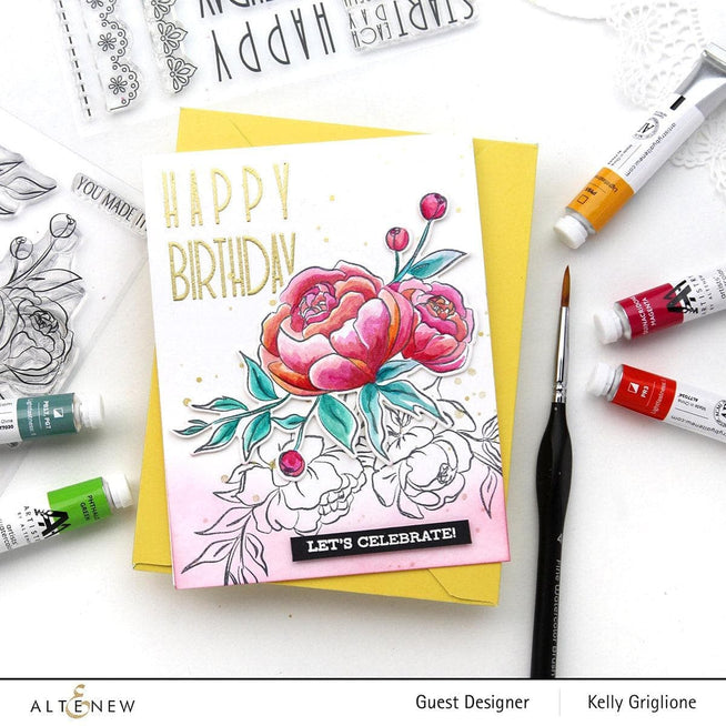 Altenew Split Primary Watercolor Bundle featuring vibrant watercolor paints and brushes arranged on a white background.