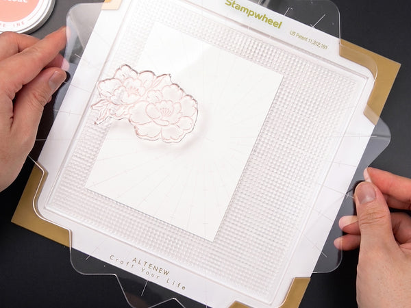 Place your cardstock on the sticky mat